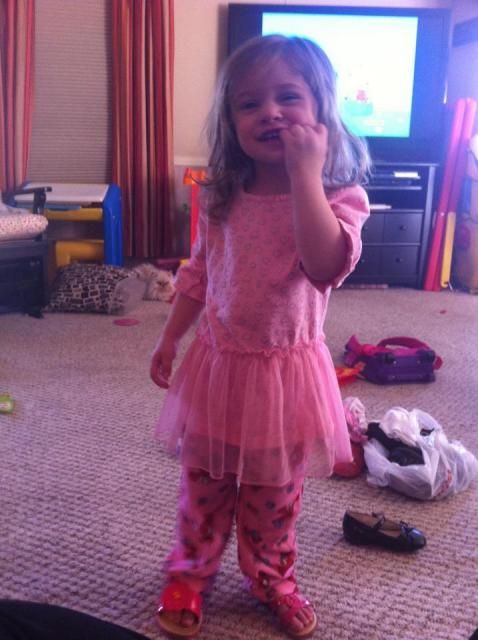 I found a bunch of clothes for Maddie today at yard sales. She helped me go through them and made her own outfit out of Elmo pj pants, two different sandals and a pink dress. She keeps twirling around saying &quot;I'm princess!&quot;.