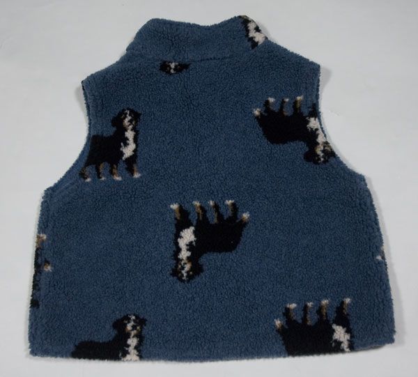   blue and features Swiss Mountain or Bernese Mountain dogs on the front